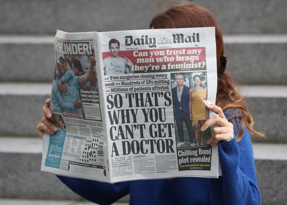 A woman reading the Daily Mail in an undated file photo. (Jonathan Brady/PA)