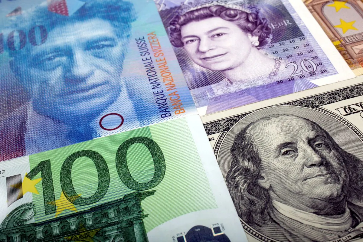 A picture illustration of the U.S. dollar, Swiss Franc, British pound, and Euro banknotes, taken in Warsaw, Poland, on Jan. 26, 2011. (Kacper Pempel/Reuters)
