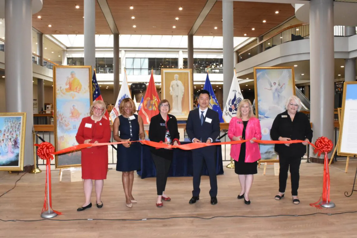 (From left to right) Suzi Voyles, president of Eagle Forum of Georgia, State Representative Mesha Mainor, State Senator Kay Kirkpatrick, Steve Sun, executive director of Falun Dafa Association of Atlanta, State Representative Shea Roberts, and Salleigh Grubbs, chairperson of Cobb County Republican Party, pose to cut the ribbon during the opening ceremony of The Art of Zhen Shan Ren International Exhibition held at the James H. 'Sloppy' Floyd Building on July 8, 2021. (The Epoch Times)