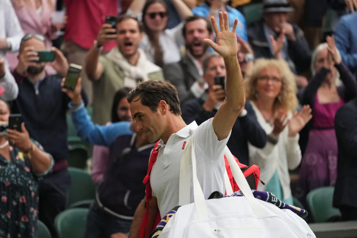 Switzerland's Roger Federer leaves the court on day nine of the Wimbledon Tennis Championships in London, on July 7, 2021. (Alberto Pezzali/AP Photo)

