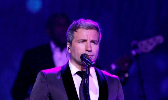 Remigio Pereira of The Canadian Tenors performs onstage at the JW Marriott Phoenix Desert Ridge Resort & Spa in Phoenix, Arizona, on April 8, 2016. (Mike Moore/Getty Images for Celebrity Fight Night)