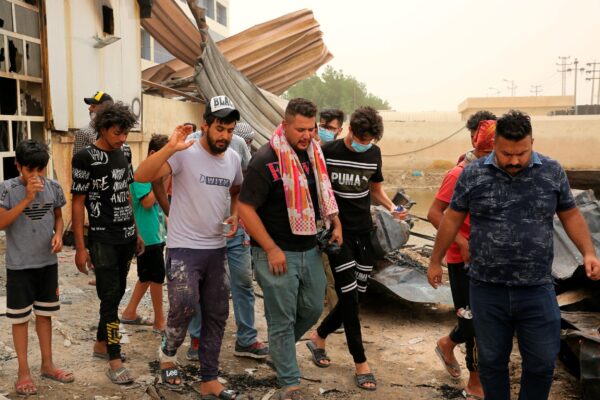 Rescuers and civilians look for bodies