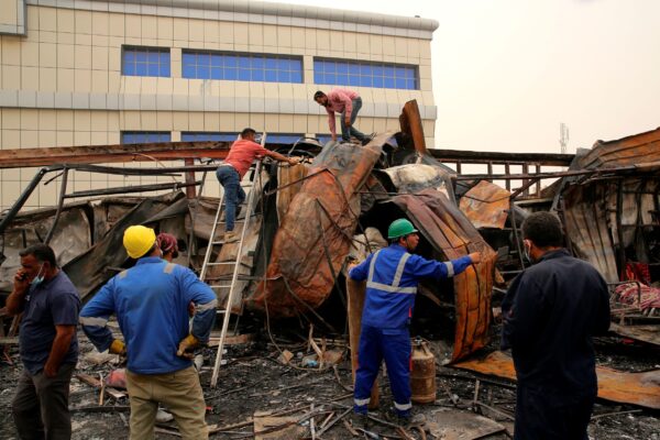 Rescuers and civilians look for bodies