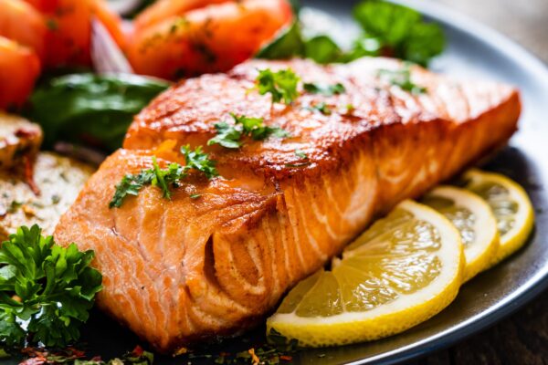 Grilled salmon steak with potatoes and vegetables