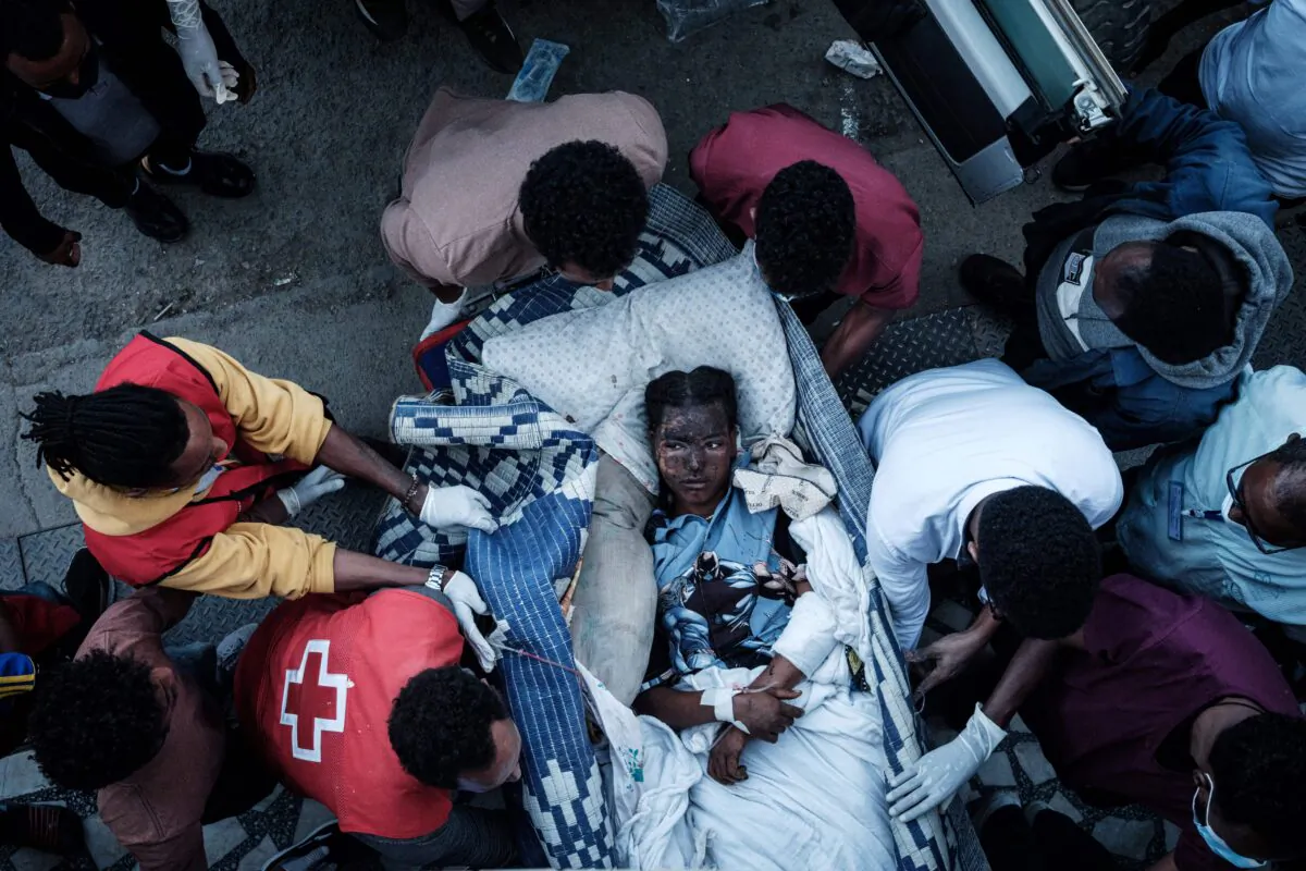 An injured resident of Togoga, a village about 20 km west of Mekele, arrives on a stretcher to the Ayder referral hospital in Mekele, the capital of Tigray region, Ethiopia, on June 23, 2021. (Yasuyoshi Chiba/AFP via Getty Images)