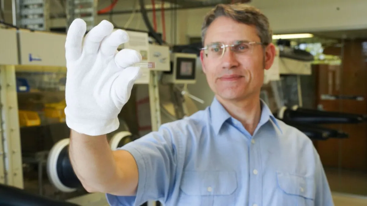 Paul Dastoor, Physicist and Research Leader at the University of Newcastle, holds a non-invasive, printable saliva test strip for diabetics, at the University of Newcastle in Newcastle, New South Wales, Australia, in this undated recent picture obtained by Reuters on July 12, 2021. (Courtesy of University of Newcastle/Handout via Reuters)