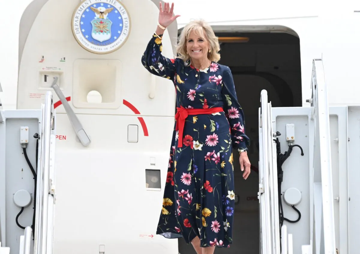  First Lady Jill Biden waves as she walks off the plane as she arrives in Savannah, Ga., on July 8, 2021. (Jim Watson/Pool/AFP via Getty Images)