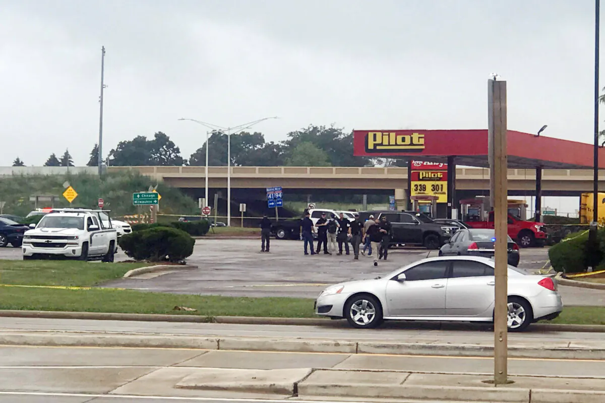 Authorities in Wisconsin respond to an apparent shooting at a Pilot Travel Center, with one witness describing a "sea of people" fleeing the store in Franksville, Wis., on July 13, 2021. (Diana Panuncial/The Journal Times via AP)