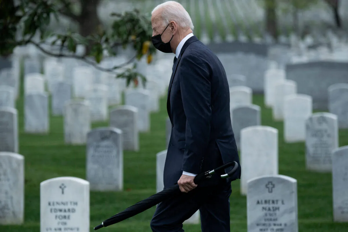 President Joe Biden walks through Arlington National Cemetery to honor fallen veterans of the Afghan conflict in Arlington, Va., on April 14, 2021. (Brendan Smialowski/AFP via Getty Images)