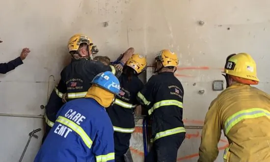 Firefighters Rescue Woman Wedged Between Two Concrete Walls