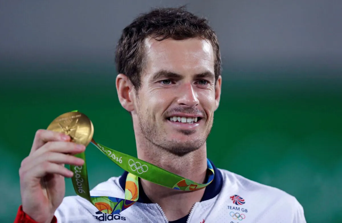 Andy Murray, of England, smiles as he holds up his gold medal at the 2016 Summer Olympics in Rio de Janeiro, Brazil, on Aug. 14, 2016. (Charles Krupa/AP Photo)