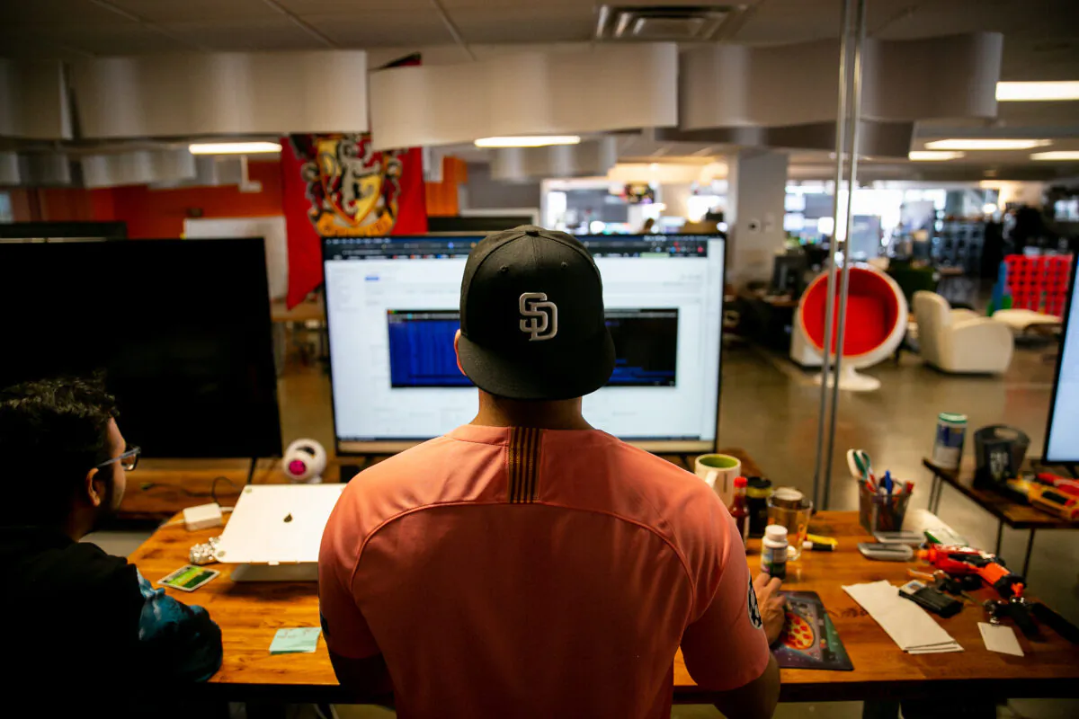 Software engineers Adrian Eufracio, right, and Digant Jagtap work together at Zeeto, an internet marketing company, in San Diego, Calif., on May 28, 2019. (Sam Hodgson/The San Diego Union-Tribune/TNS)
