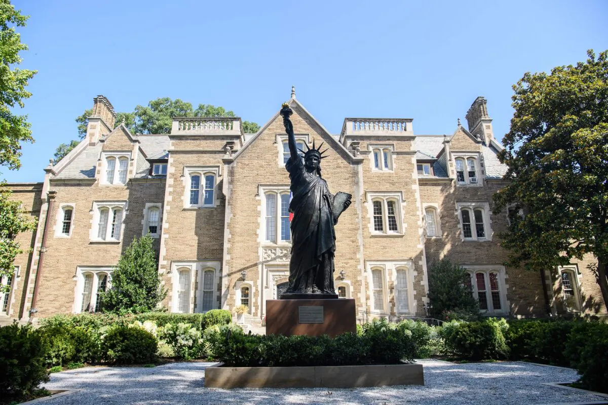 A three-meter replica of the Statue of Liberty is unveiled at the residence of the French Ambassador to the United States in Washington, on July 13, 2021. (Nicholas Kamm/AFP via Getty Images)