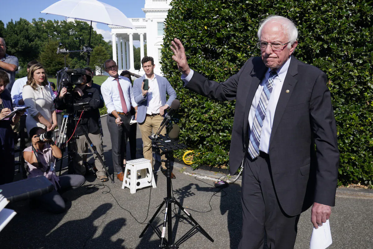Sen. Bernie Sanders (I-Vt.) talks to reporters outside the West Wing of the White House in Washington, July 12, 2021. (AP Photo/Susan Walsh)