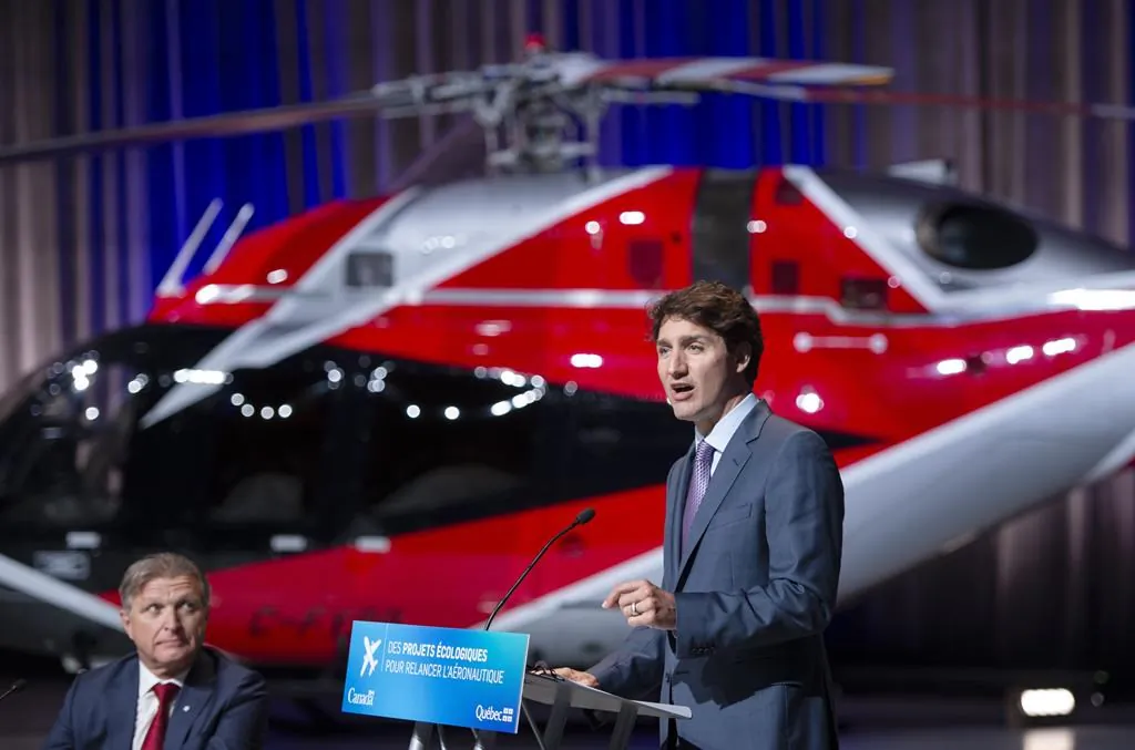 Prime Minister Justin Trudeau makes an aerospace economic announcement as President and Chief Executive Officer of CAE Inc. Marc Parent looks on July 15, 2021 in Montreal. (The Canadian Press/Ryan Remiorz)