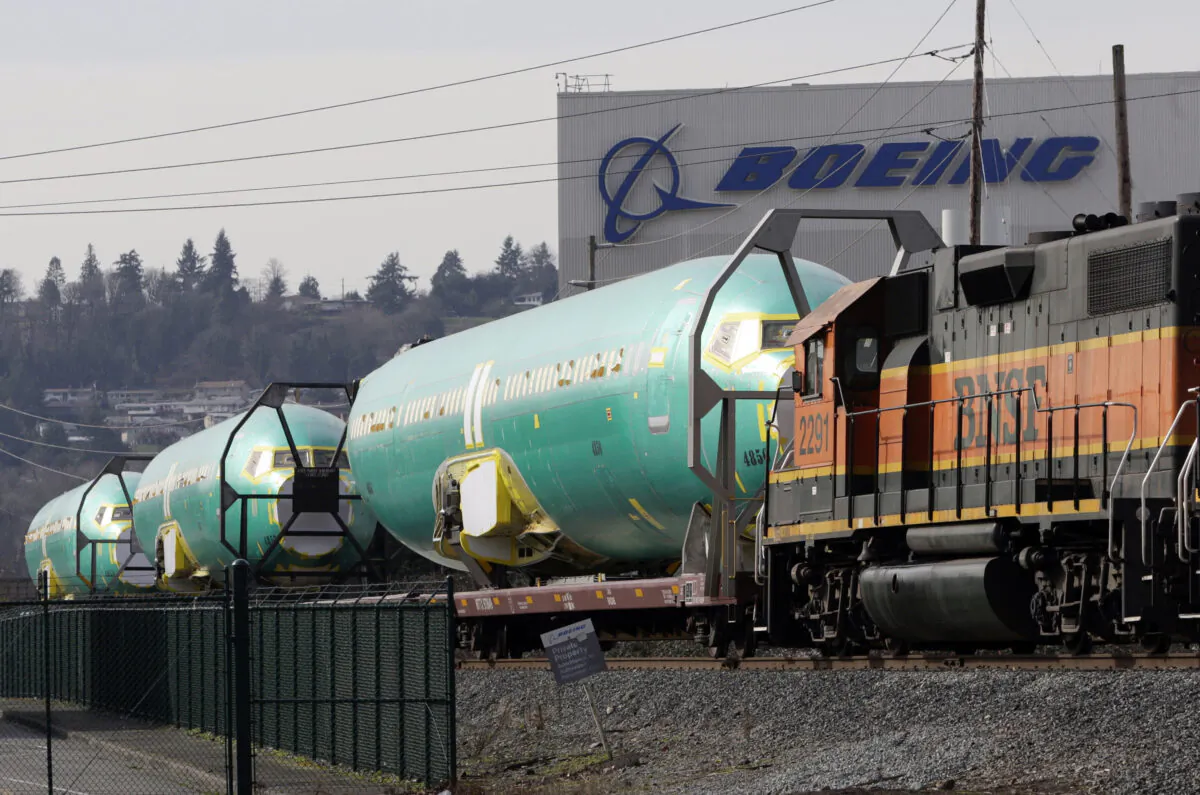 Boeing 737 fuselages are delivered by Burlington Northern Santa Fe (BNSF) train to a Boeing manufacturing site in Renton, Washington on Feb. 27, 2014. (Jason Redmond/Reuters)