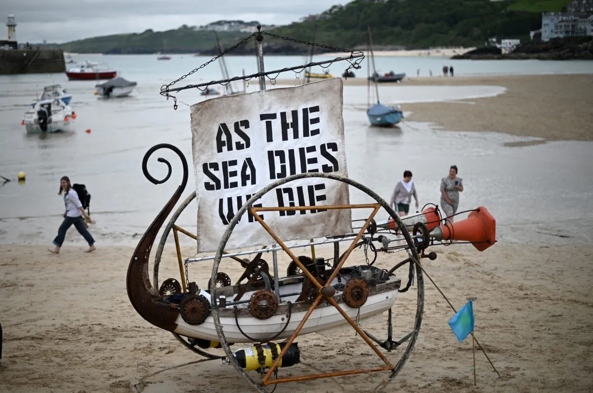 A boat sculpture is pictured during a climate change protest on the beach in St Ives, Cornwall, England, during the G7 summit on June 11, 2021.  (Daniel Leal-Olivas/AFP via Getty Images)