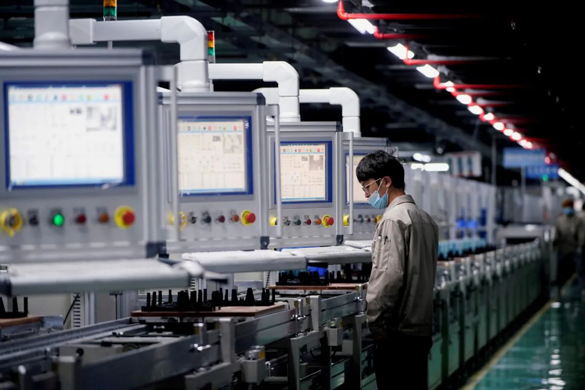 An employee works on the production line of electric vehicle (EV) battery manufacturer Octillion in Hefei, Anhui province, China, on March 30, 2021. (Aly Song/Reuters)