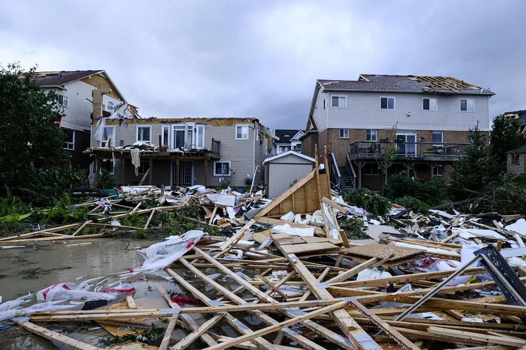 Damage left after a tornado touched down in a neighbourhood of Barrie, Ont., on July 15, 2021. (The Canadian Press/Christopher Katsarov)