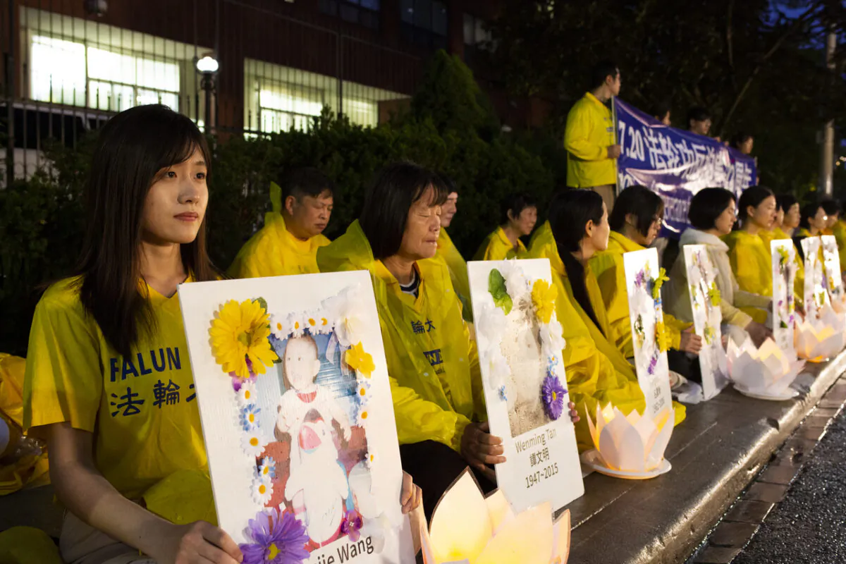 Falun Gong adherents attend a candlelight vigil in front of the Chinese Consulate in Toronto on July 15, 2021, marking 22 years of persecution by the Chinese communist retime and calling on the regime to end its persecution of their spiritual practice in China. (Evan Ning/The Epoch Times)