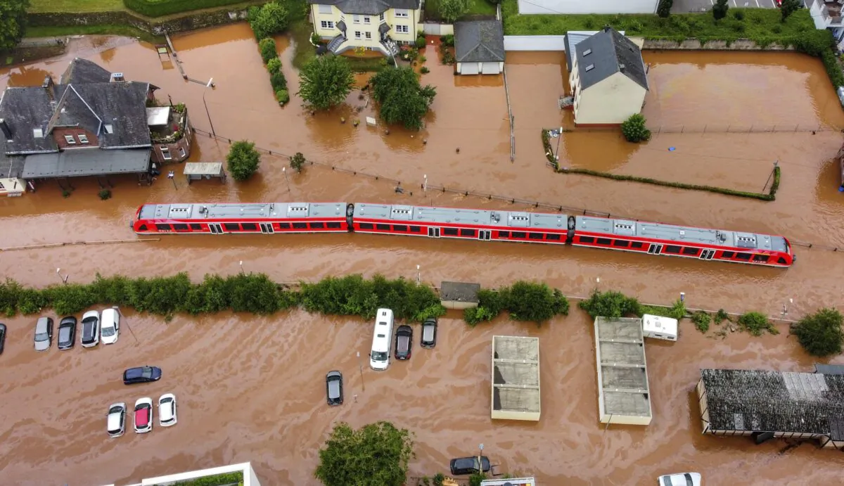 A regional train sits in the flood waters at the local station in Kordel, Germany, on July 15, 2021. (Sebastian Schmitt/dpa via AP)