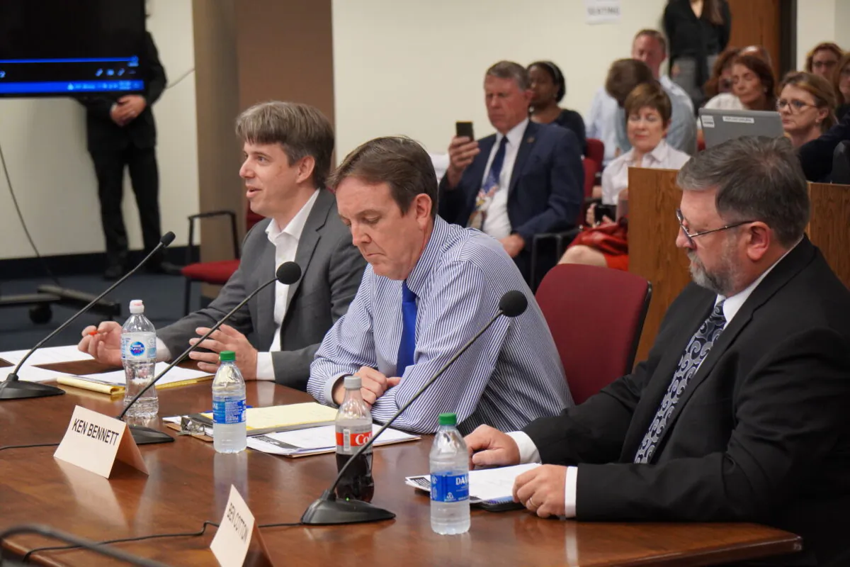 (L-R) Doug Logan, CEO of Cyber Ninjas, the firm leading Arizona's vote audit in Maricopa County, gives testimony on preliminary findings at a Senate hearing, sitting beside Arizona Senate audit liason Ken Bennett, and Ben Cotton, the founder of digital security firm called CyFIR LLC, in Phoenix, Ariz., on July 16, 2021. (Allan Stein/Epoch Times)