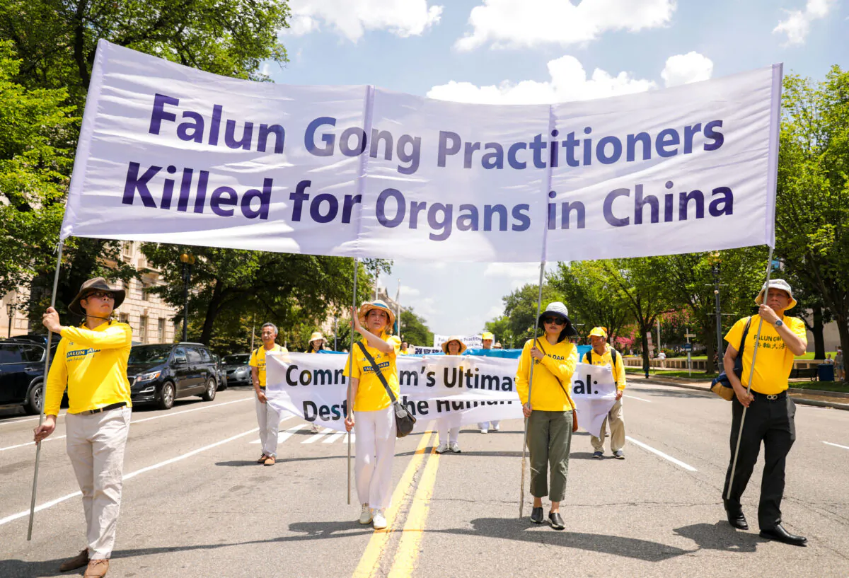 Falun Gong practitioners take part in a parade marking the 22nd anniversary of the start of the Chinese regime's persecution of Falun Gong, in Washington on July 16, 2021. (Samira Bouaou/The Epoch Times)