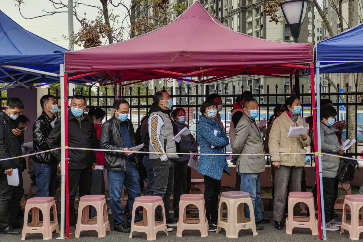 Residents line up to receive the COVID-19 vaccine at a community hospital in Wuhan, Hubei Province, China, on March 23, 2021. (Getty Images)