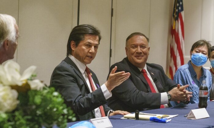 A file image of Nury Turkel, the vice chair of the U.S. Commission on International Religious Freedom, meeting with then-U.S. Secretary of State Mike Pompeo and Chinese dissidents in Washington in July 2020. (Ron Przysucha/U.S. State Department)