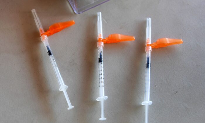 Syringes with the COVID-19 Pfizer vaccine are pictured ready for use at a mobile clinic in Los Angeles, Calif., on July 9, 2021. (Frederic J. Brown/AFP via Getty Images)