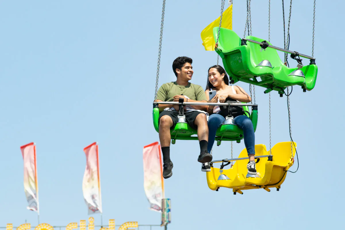 People enjoy opening day of the Orange County Fair in Costa Mesa, Calif., on July 16, 2021. (John Fredricks/The Epoch Times)