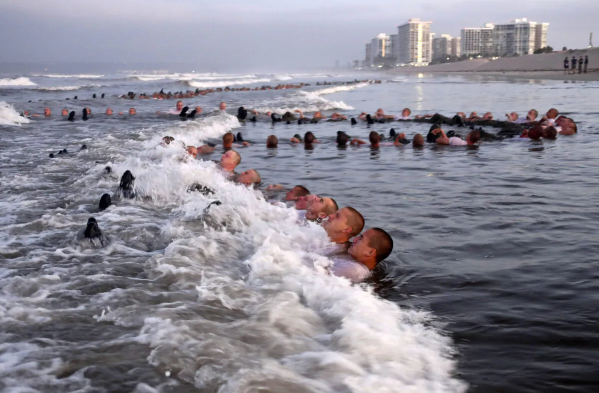 Navy SEAL candidates participate in "surf immersion" during training in Coronado, Calif., on May 4, 2020. (MC1 Anthony Walker/U.S. Navy via AP)