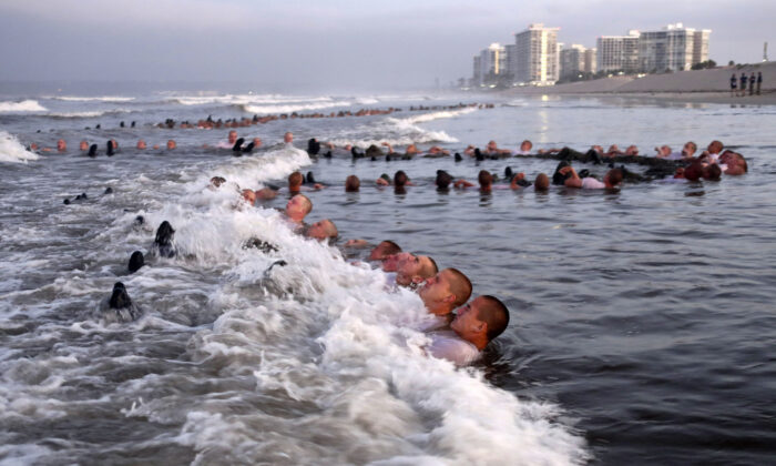 Navy SEAL candidates participate in "surf immersion" during training in Coronado, Calif., on May 4, 2020. (MC1 Anthony Walker/U.S. Navy via AP)