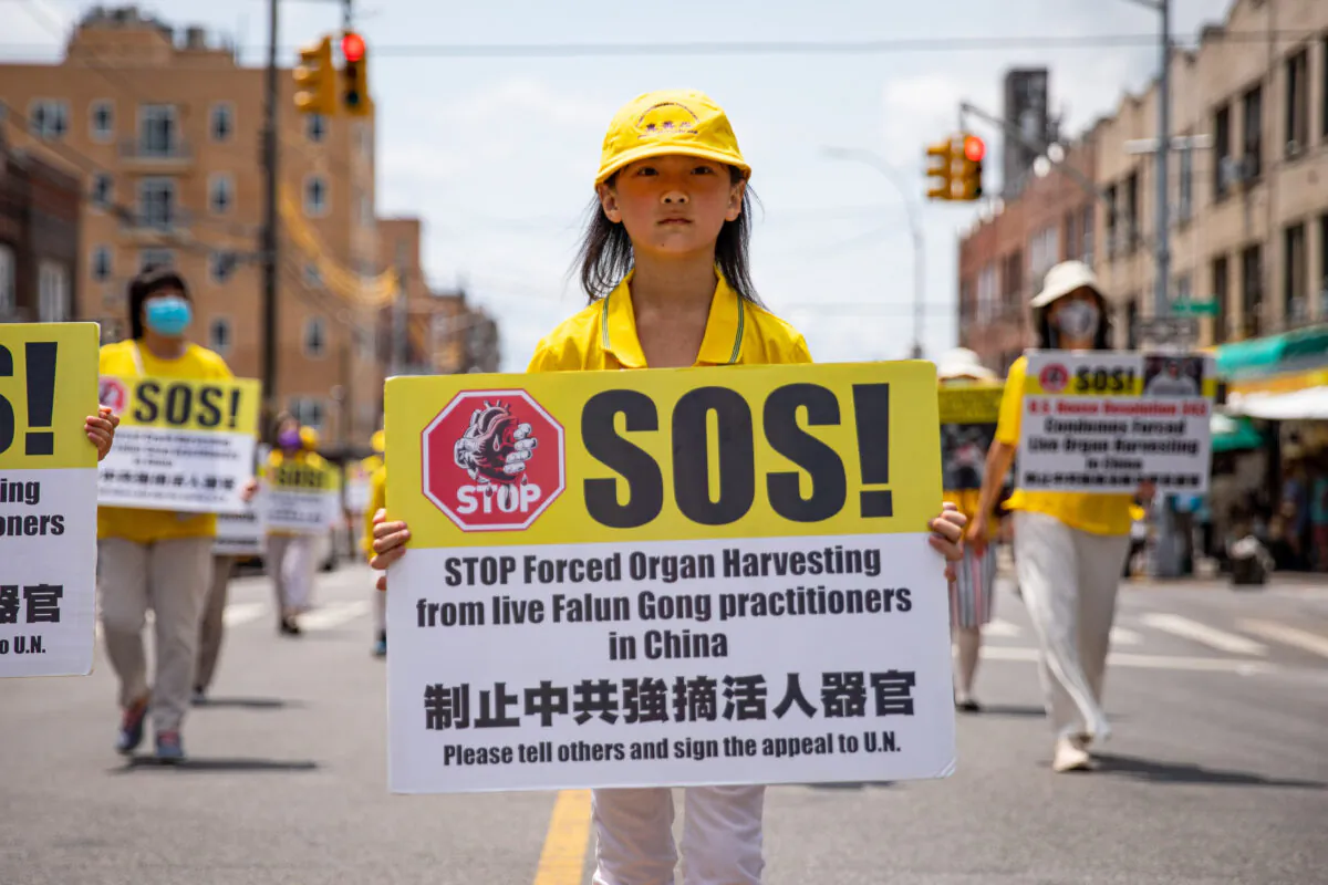 Falun Gong practitioners take part in a parade marking the 22nd year of the persecution of Falun Gong in China, in Brooklyn, New York, on July 18, 2021. (Chung I Ho/The Epoch Times)