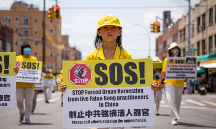 Falun Gong practitioners take part in a parade marking the 22nd year of the persecution of Falun Gong in China, in Brooklyn, New York, on July 18, 2021. (Chung I Ho/The Epoch Times)