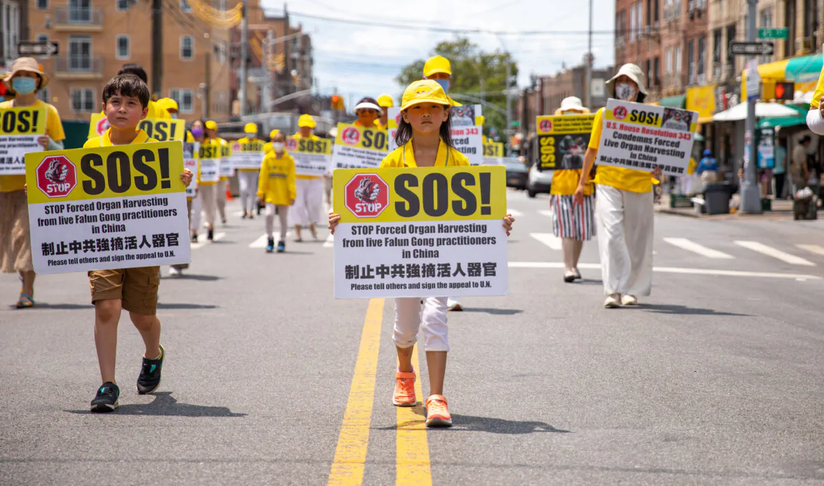 Falun Gong practitioners take part in a parade marking the 22nd year of the persecution of Falun Gong in China, in Brooklyn, N.Y., on July 18, 2021. (Chung I Ho/The Epoch Times)