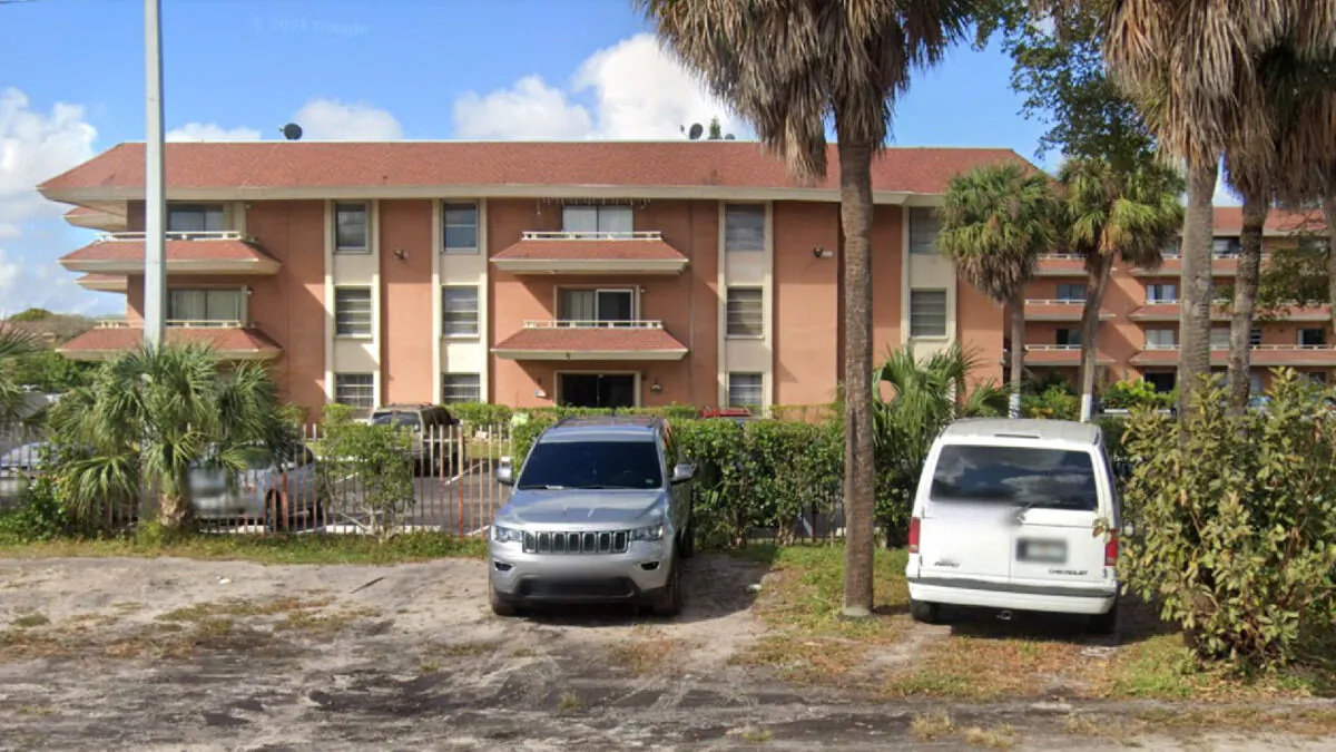 The three-story apartment building at 17500 NW 68th Ave in northwestern Miami-Dade County, Fla., in February 2021, before its roof partially collapsed. (Google Maps)