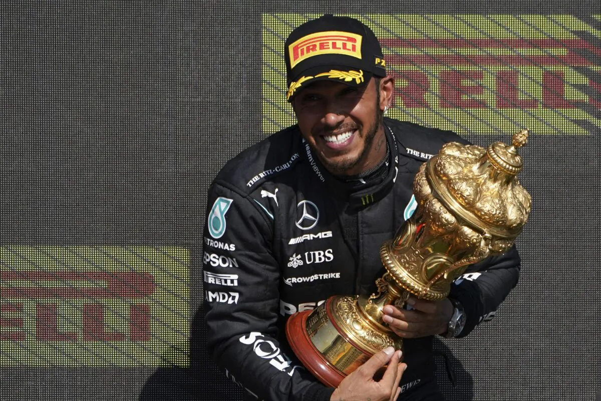 Mercedes driver Lewis Hamilton of Britain celebrates on the podium after winning the British Formula One Grand Prix, at the Silverstone circuit, in Silverstone, England, on July 18, 2021. (Jon Super/AP Photo)