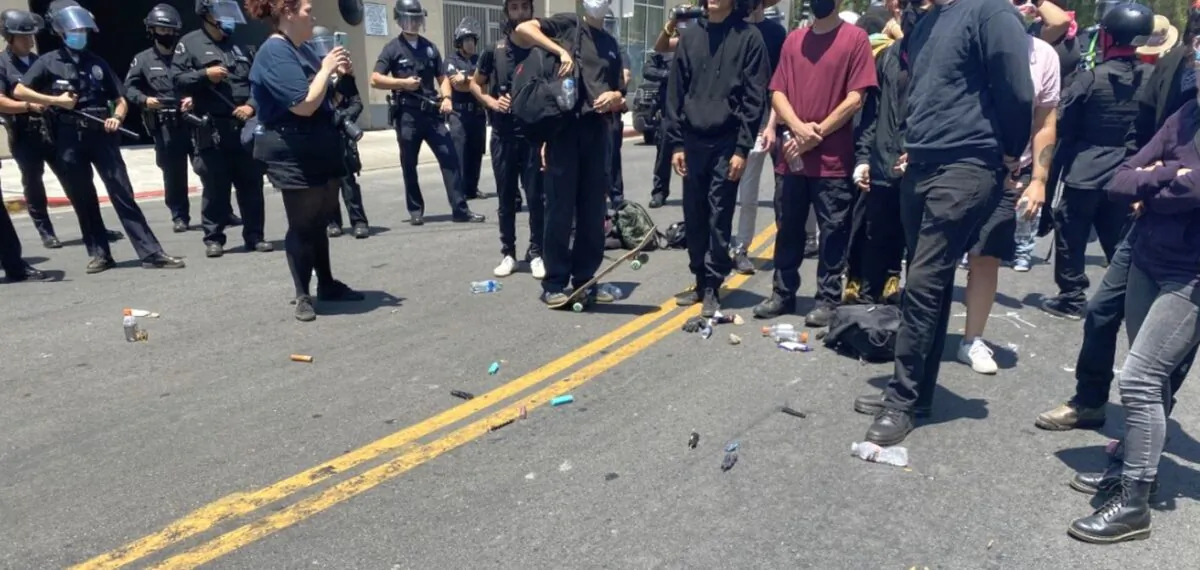 The LAPD said dozens of people were arrested amid protests and counter-protests at a Korean spa in Los Angeles on July 17. (LAPD HQ Twitter/ Screenshot via The Epoch Times)