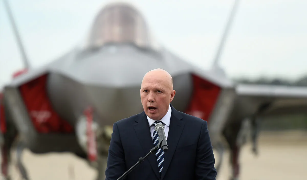 Australia's Minister for Defence Peter Dutton speaks during a ceremony to mark the official commencement of Exercise Talisman Sabre, RAAF Base Amberley, in Brisbane on July 14, 2021. (AAP Image/Albert Perez)