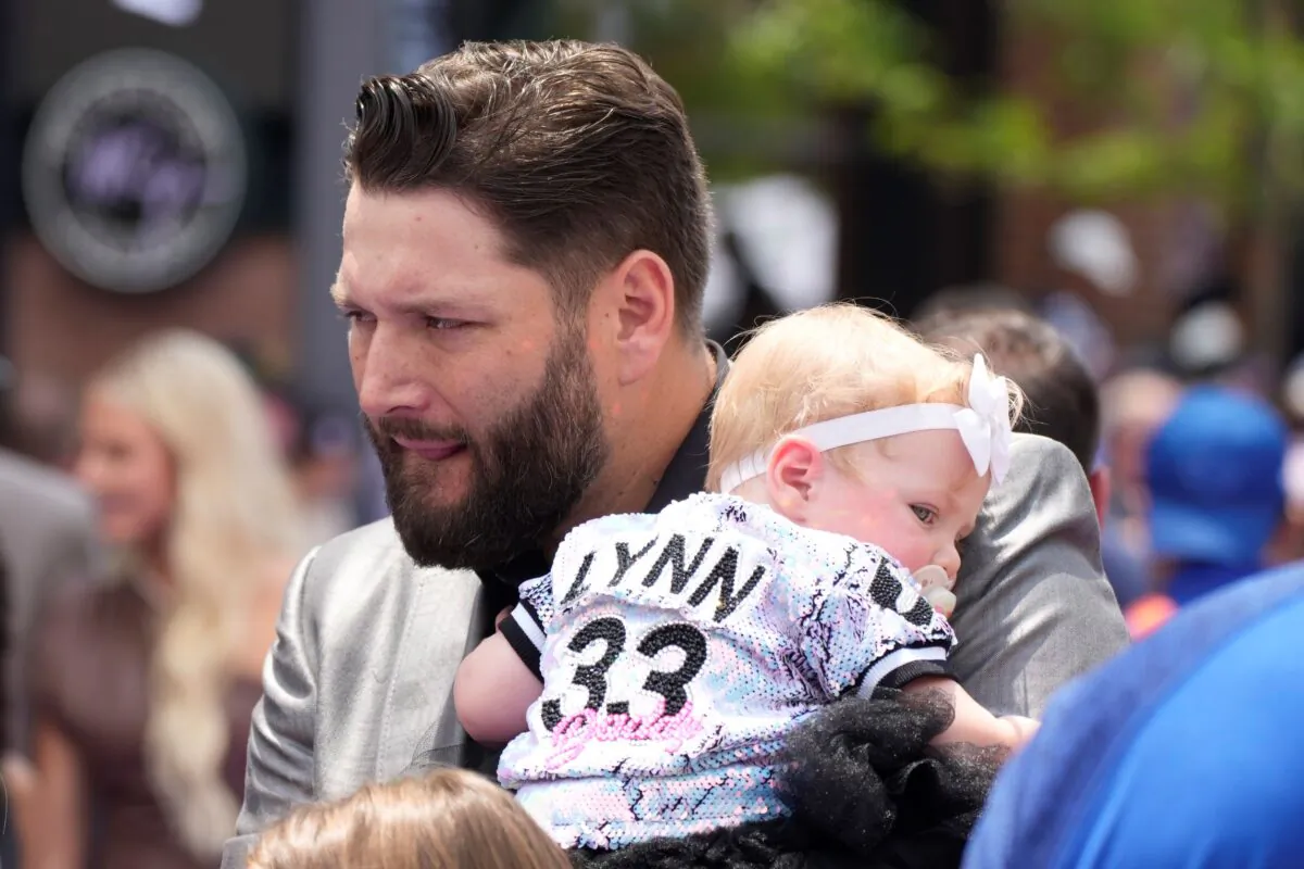 American League's Lance Lynn, of the Chicago White Sox, arrives with his daughter, Mia Jane Lynn, at the All Star Red Carpet event prior to the MLB All-Star baseball game, in Denver, on July 13, 2021. (David Zalubowski/AP Photo)