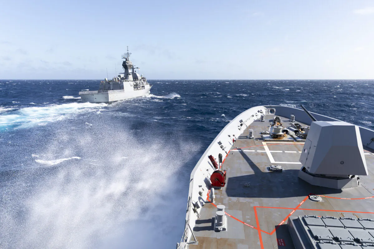 HMAS Brisbane sails alongside HMAS Parramatta during replenishment at sea approach, off the coast of Queensland, during Exercise Talisman Sabre 2021. Exercise Talisman Sabre 2021 (TS21) is the largest bilateral training activity between Australia and the United States, commencing on 14 July 2021. (Supplied: Australian Department of Defence)