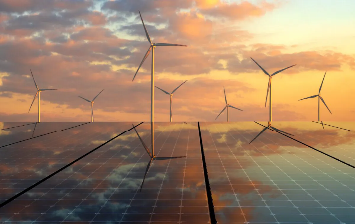 Solar panels and wind turbines. (Mike Mareen/Adobe Stock)