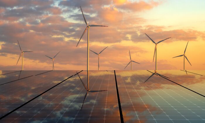 Solar panels and wind turbines. (Mike Mareen / Adobe Stock)
