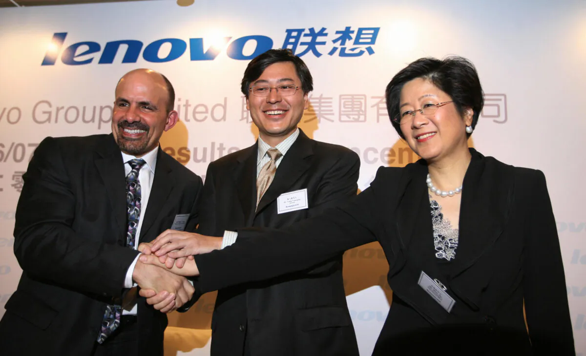 William J Amelio (L), president and CEO of Lenovo Group, Yang Yuanqing, chairman of Lenovo Group (C), and Mary Ma, senior VP and chief financial officer at a press conference in Hong Kong, on May 23, 2007. (Mike Clarke/AFP via Getty Images)