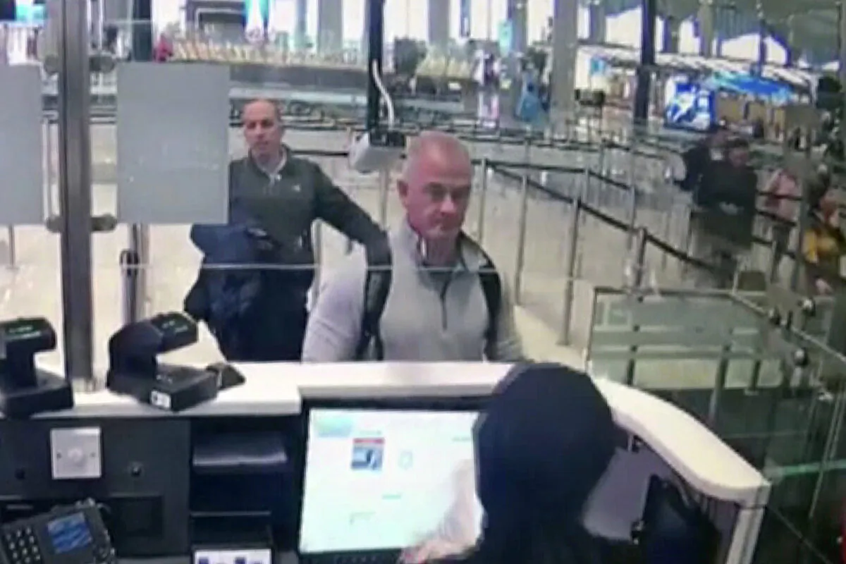 This image from a security camera video shows Michael L. Taylor, center, and George-Antoine Zayek at passport control at Istanbul Airport in Turkey on Dec. 30, 2019. (DHA via AP, File)