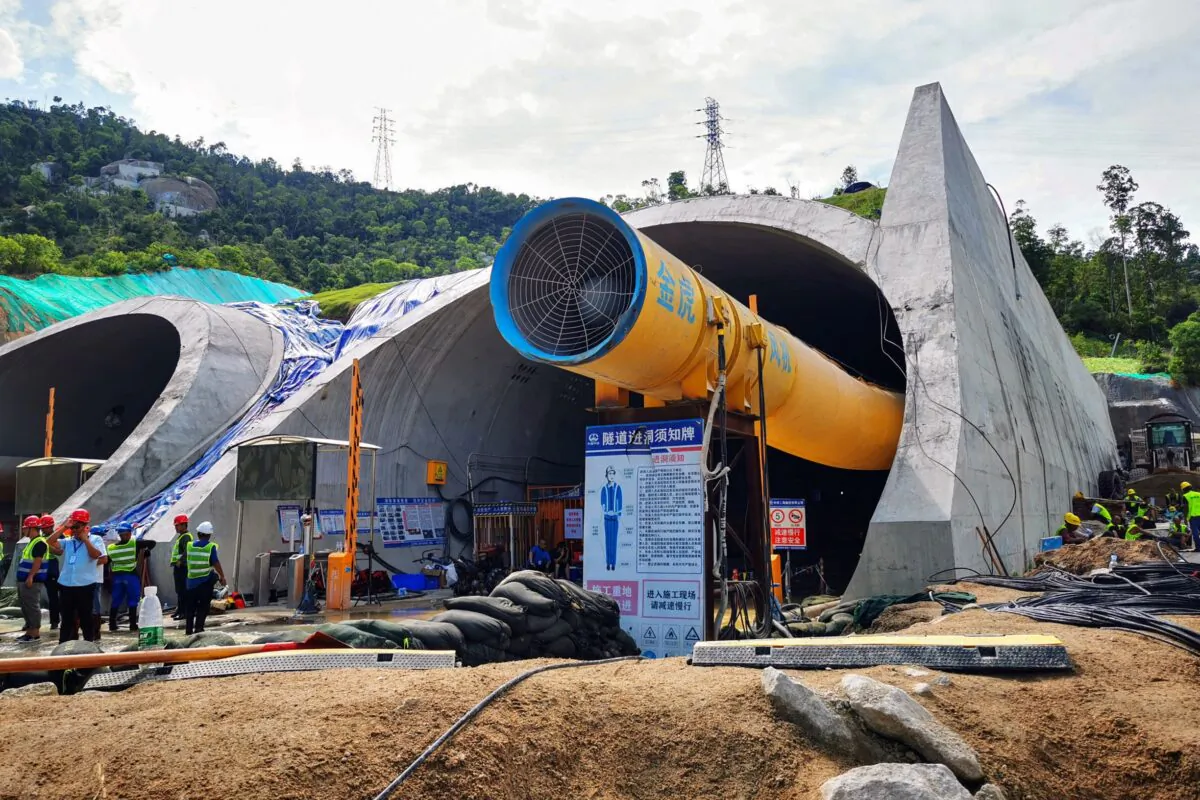 Rescuers work to clear a flooded tunnel after 14 construction workers were trapped in an underground section of a new highway construction site after it collapsed in Zhuhai in China's southern Guangdong province on July 16, 2021. (STR/AFP via Getty Images)
