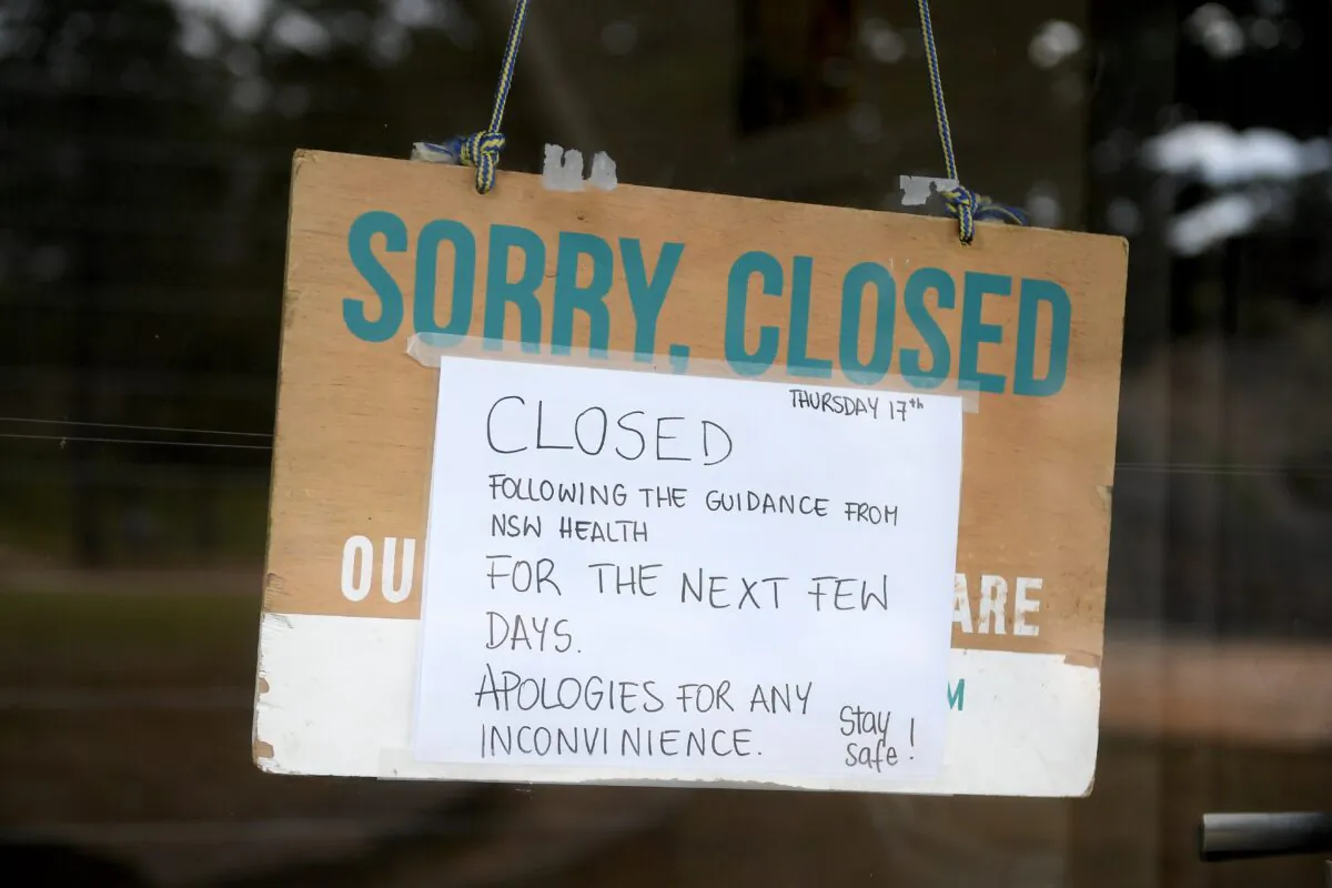 A closed sign is seen on a business at Newport beach, in Sydney, Australia on Dec. 18, 2020. (AAP Image/Dan Himbrechts)