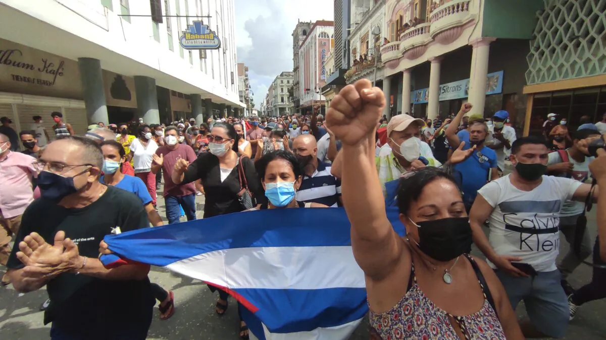 People take part in a demonstration to support the government of the Cuban President Miguel Diaz-Canel in Havana, on July 11, 2021. Thousands of Cubans took part in rare protests Sunday against the communist government, marching through a town chanting "Down with the dictatorship" and "We want liberty." (Yamil Lage/AFP via Getty Images)
