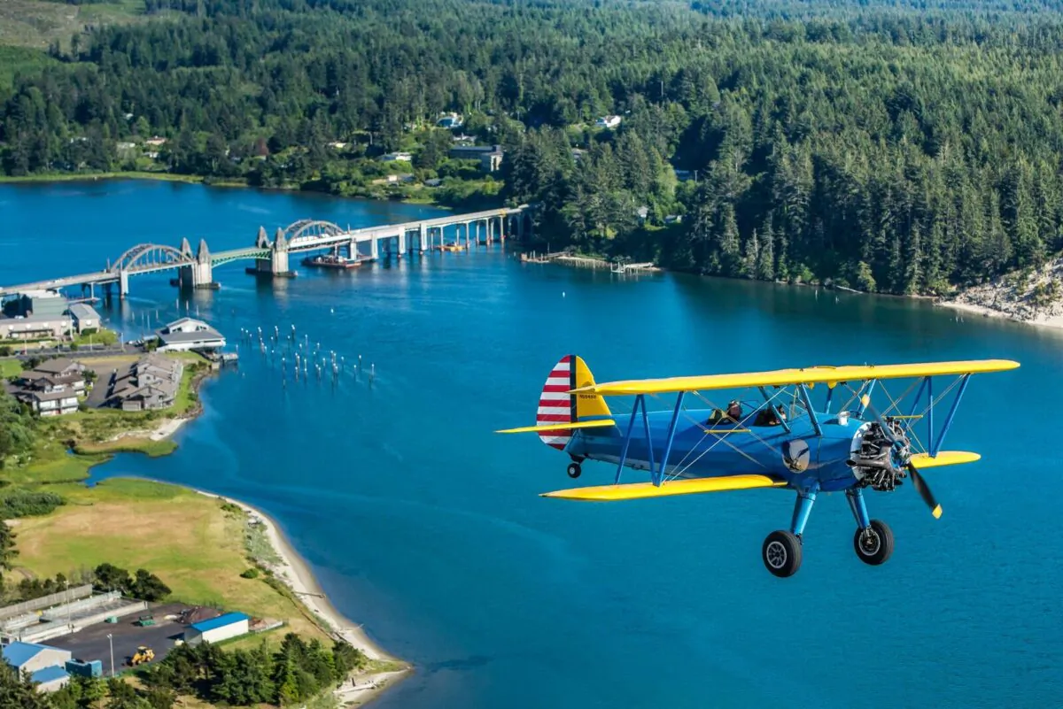 Terry and Winette Tomeny fly pass the majestic Siuslaw River Bridge in Florence, Oregon, in their legendary Stearman “Kaydet.” The aircraft was the primary trainer for the U.S. Army Air Corps in World War II and is arguably the most famous biplane ever made. Tomeny Aero offers tours and flight lessons. In 2017 the Tomenys and retired airline captain Sam Spayd opened the Florence Aviation Academy, working with The Boys and Girls Club to inspire the next generation of pilots and engineers. (Courtesy of Tomeny Aero Inc)